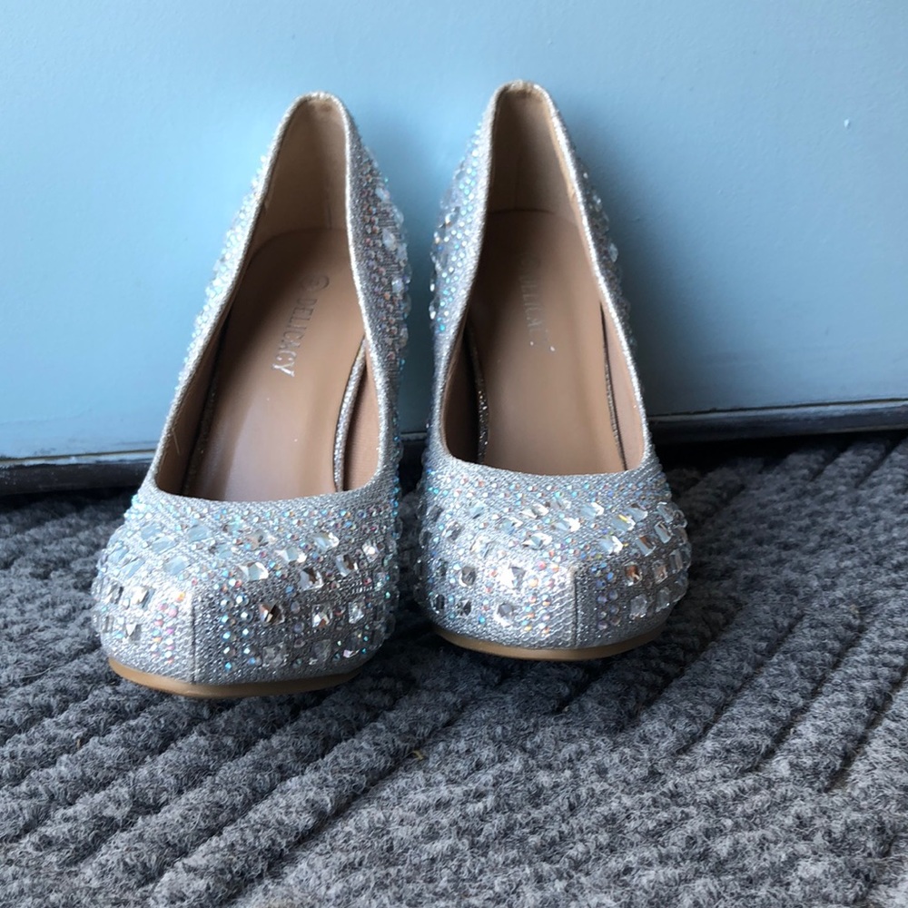 Delicacy, silver high heels.